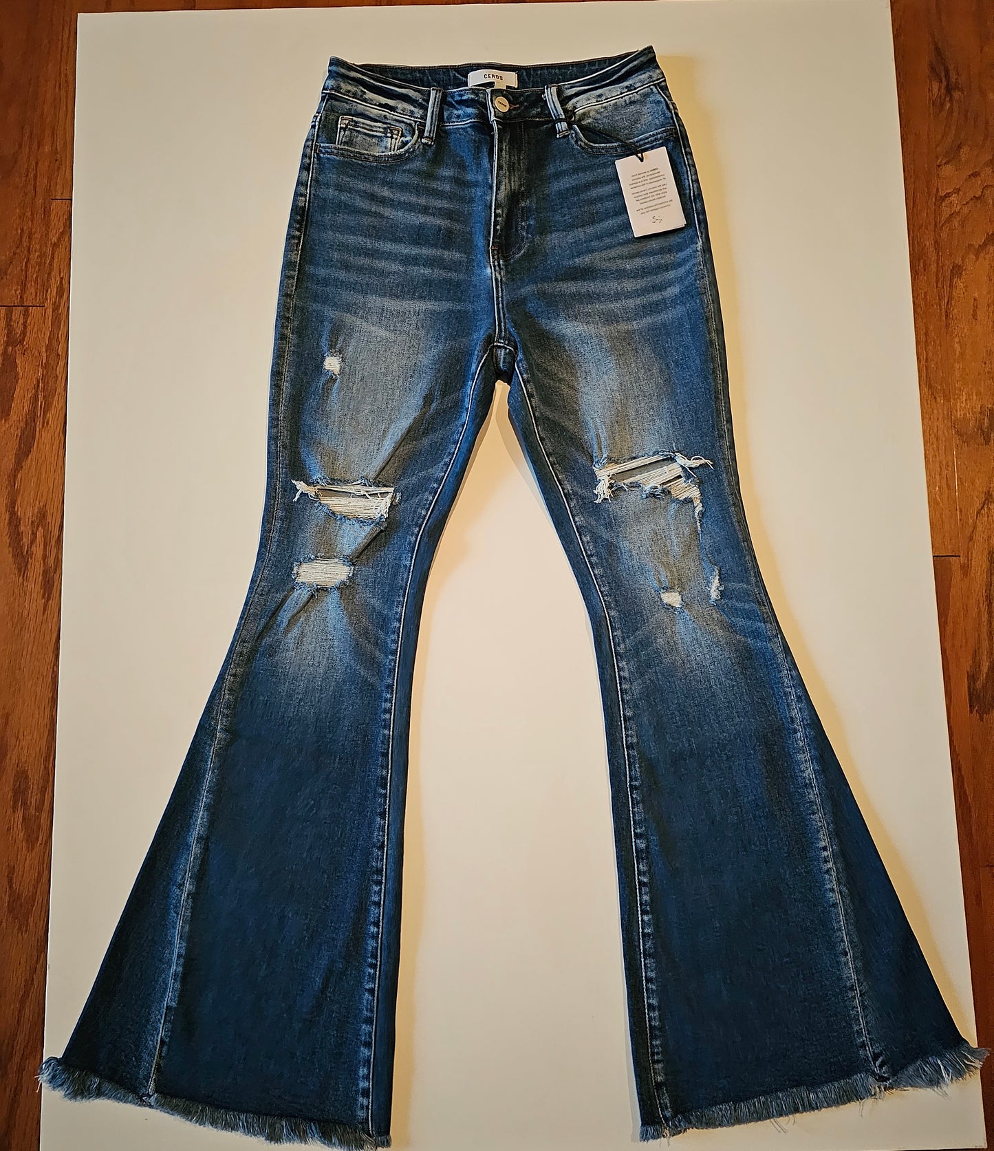 HIGH RISE SUPER FLARE DISTRESSED JEANS