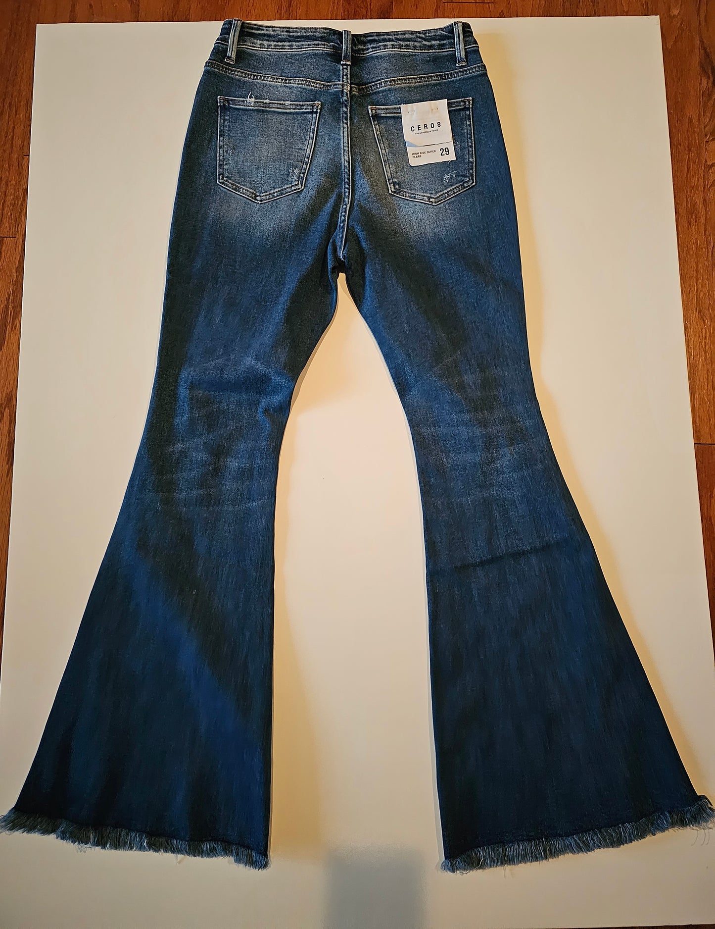 HIGH RISE SUPER FLARE DISTRESSED JEANS